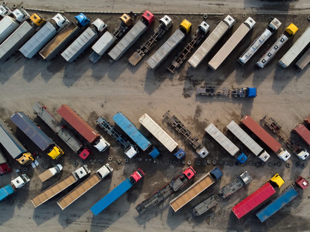 aerial view of a parking lot of trucks ready for loading containers and delivery